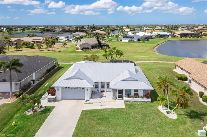 Aerial view of residential area featuring a large body of water