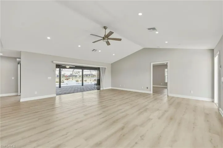 Unfurnished living room featuring ceiling fan, light wood-type flooring, and recessed lighting