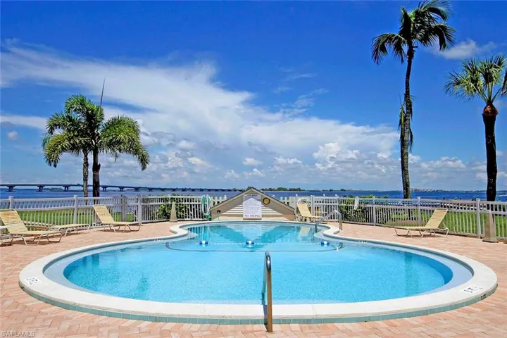 Community pool featuring a patio