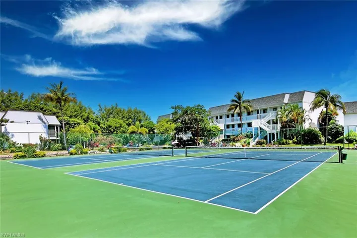 View of tennis court with community basketball court