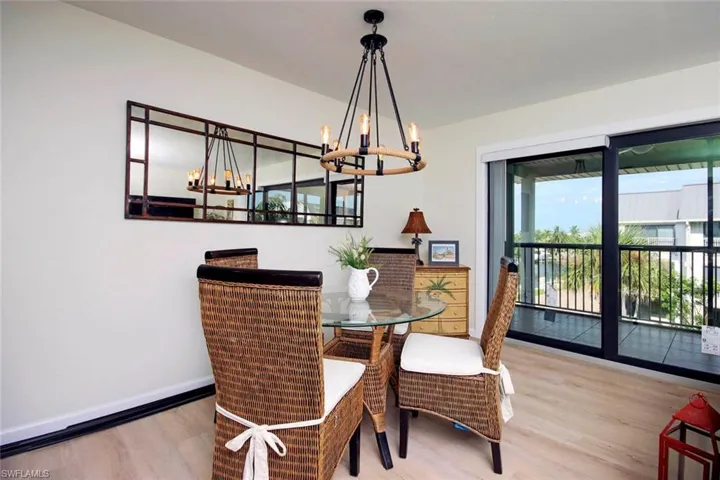 Dining space featuring light wood finished floors and a chandelier