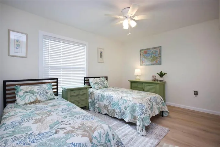 Bedroom featuring a ceiling fan and light wood finished floors