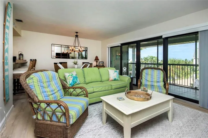 Living area featuring wood finished floors and a chandelier