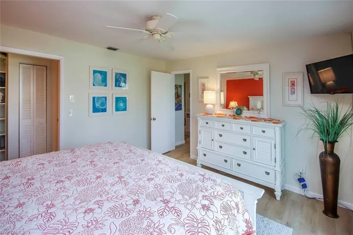 Bedroom with light wood-style flooring and ceiling fan