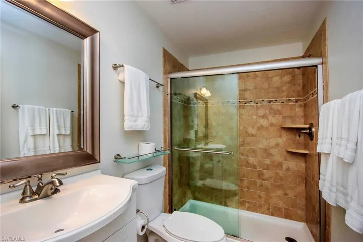Bathroom with vanity and a shower stall
