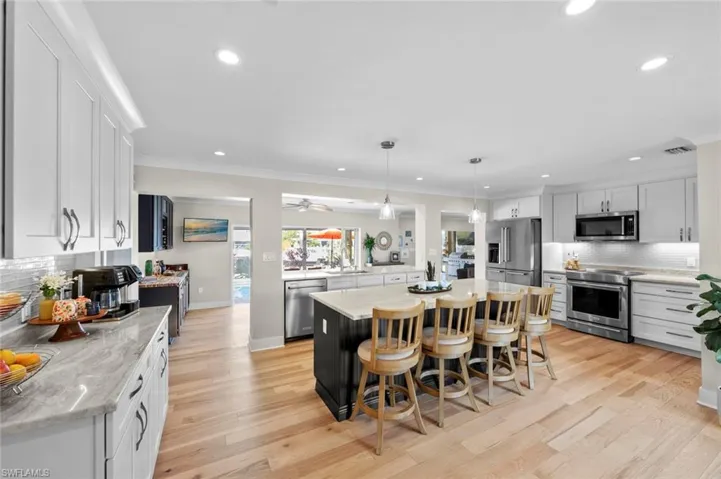 Light bright kitchen looks through to the outdoors