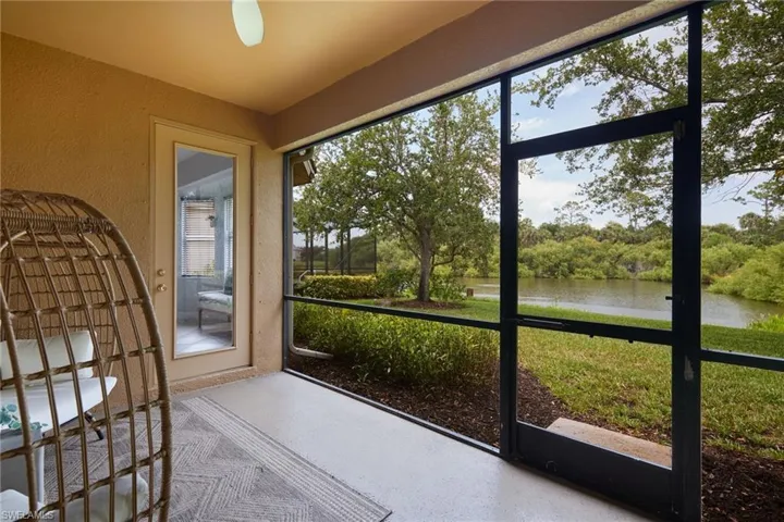 Screened patio with textured stucco walls and a smooth concrete floor