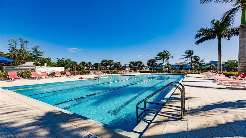 Community pool featuring a patio