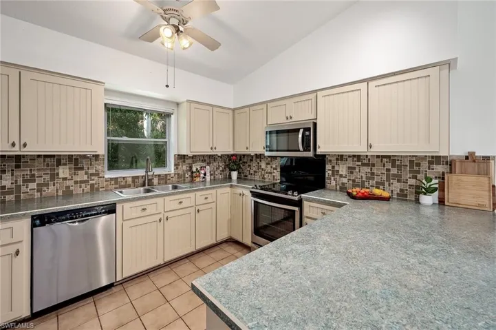 Vaulted ceiling & SS appliances.
