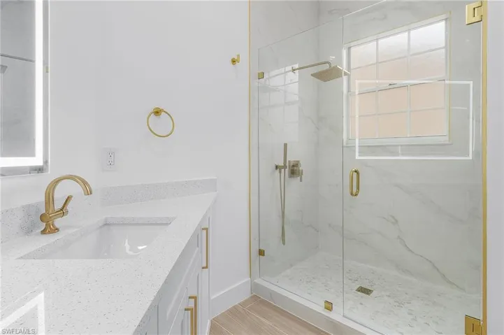 Bathroom with vanity and an enclosed shower