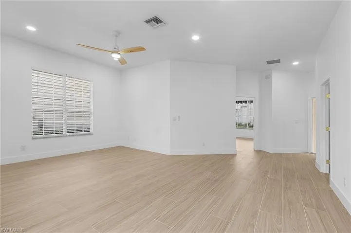 Spare room with ceiling fan