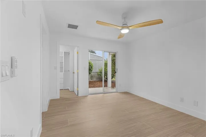 Spare room featuring light hardwood / wood-style floors and ceiling fan