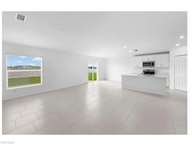 Bright open-concept living and dining area.