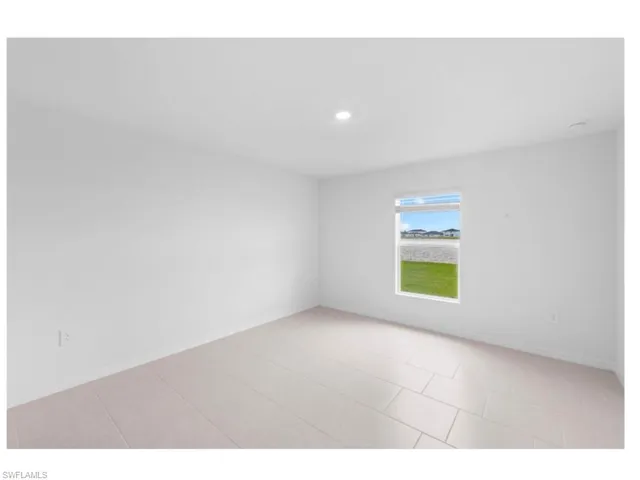 Comfortable primary suite with abundant natural light.