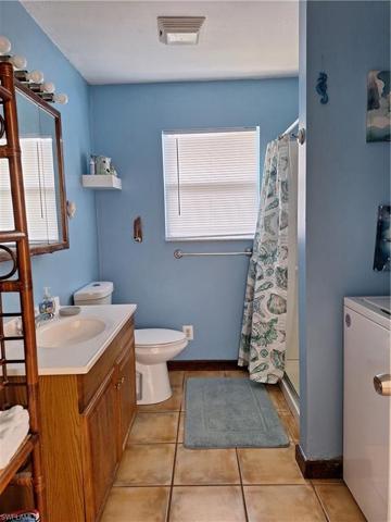 Main floor bathroom with laundry room