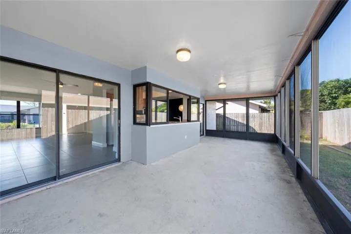 Unfurnished sunroom featuring a wealth of natural light