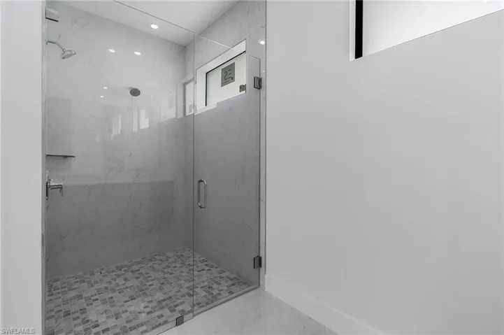 Bathroom with a shower with shower door