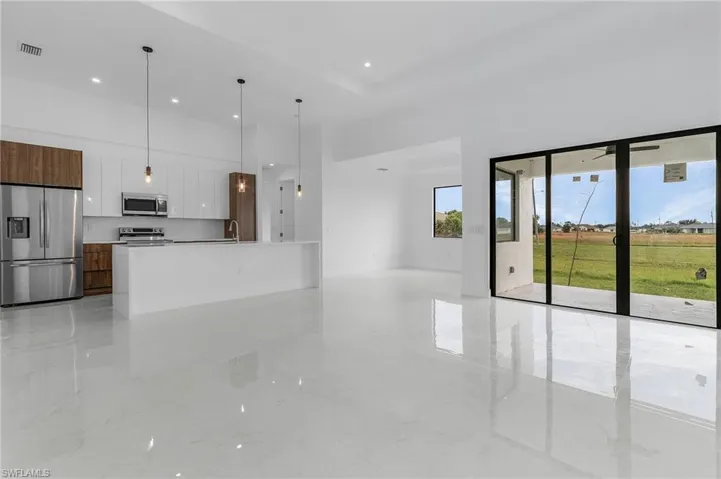 Unfurnished living room with sink