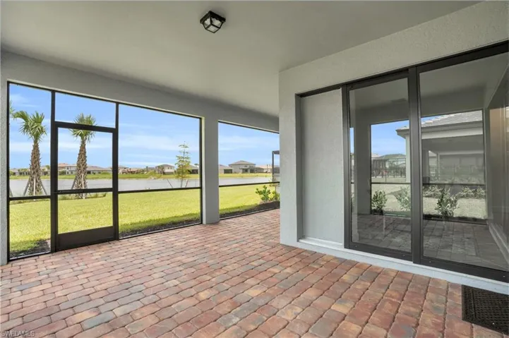 Unfurnished sunroom featuring a wealth of natural light