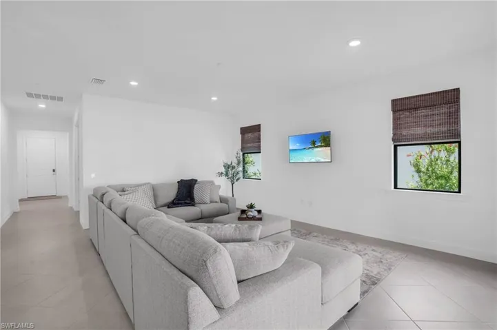 Living room featuring light tile patterned floors