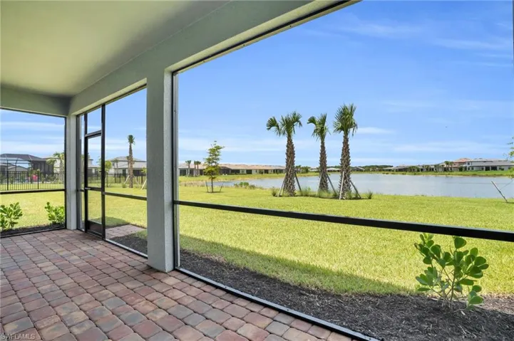 Unfurnished sunroom featuring a water view