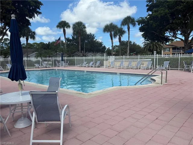 Community pool with a patio area