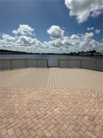 View of patio with a water view