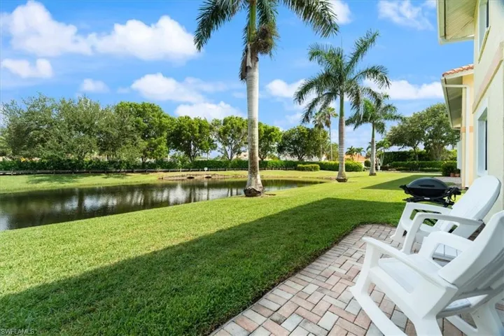 View of green lawn with a water view
