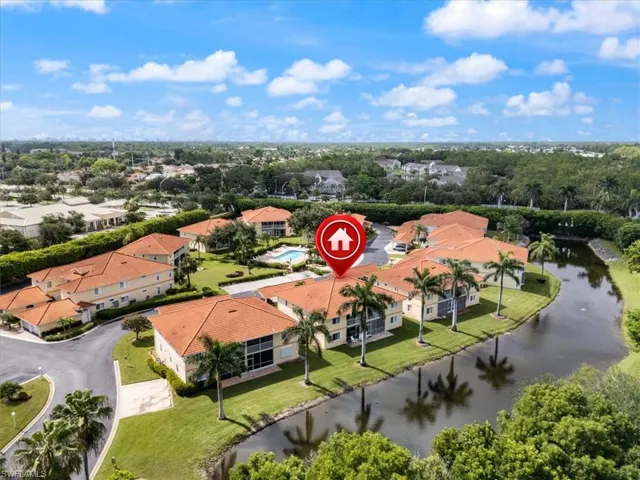 Aerial perspective of suburban area featuring a large body of water