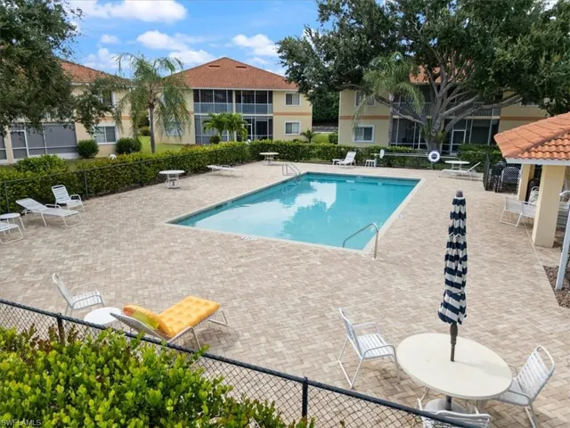 Community pool featuring a patio