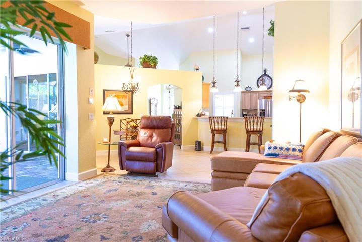 View from the living room to the kitchen- the home feels larger with the vaulted ceilings.