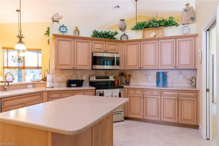 Kitchen with lots of cabinets and storage compartments.
