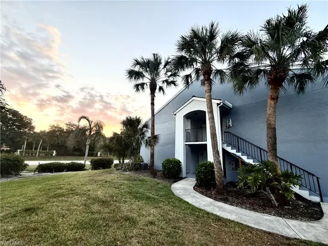 Property at dusk featuring stairway