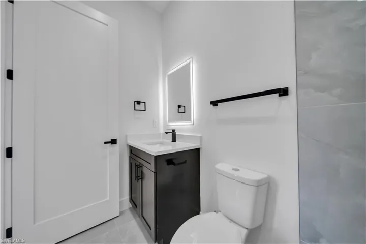 Bathroom featuring vanity and toilet