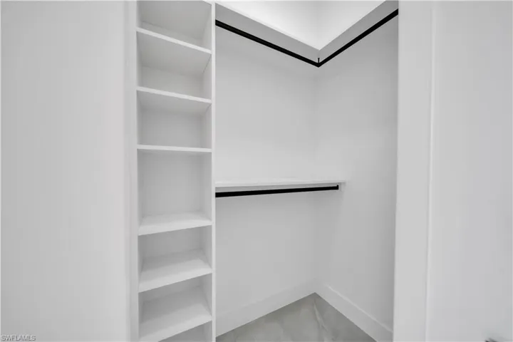 Spacious closet with marble look tiles