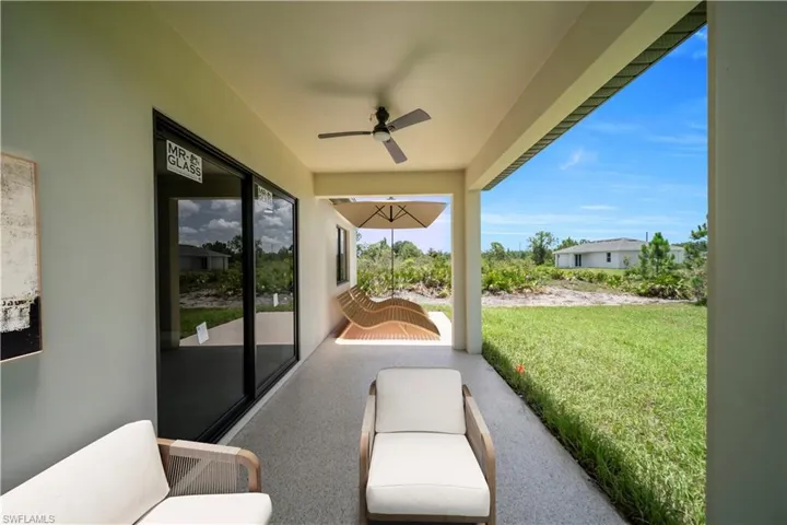 View of patio featuring ceiling fan