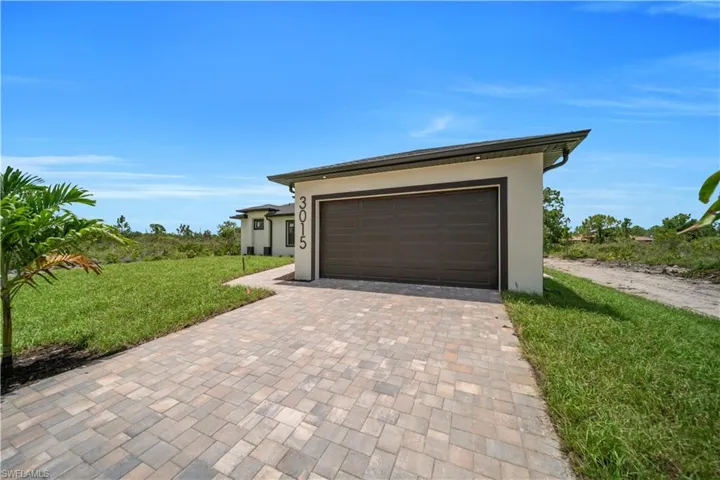 Garage with decorative driveway