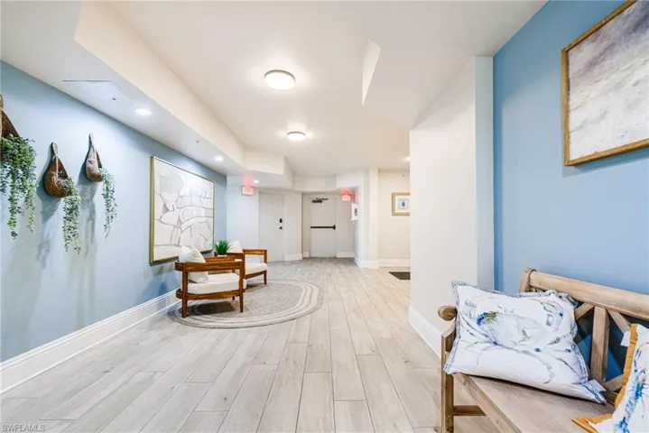 Hall featuring light wood-style flooring and recessed lighting