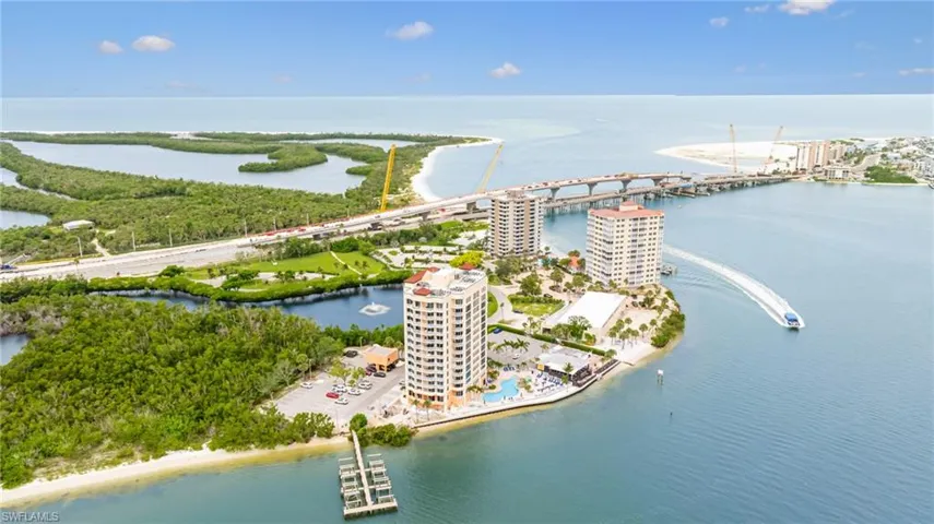 Drone / aerial view of a nearby body of water and a notable bridge