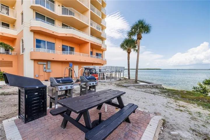 View of patio / terrace featuring a water view and a grill