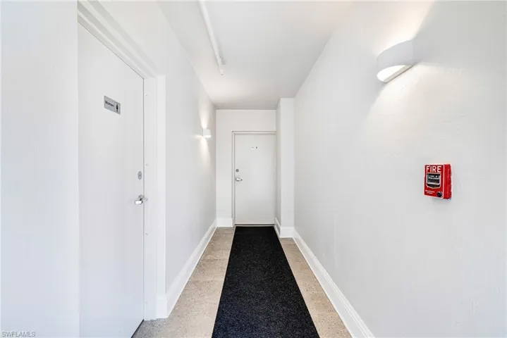 Hall featuring baseboards