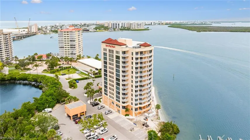 View of urban area featuring apartment complex and a nearby body of water