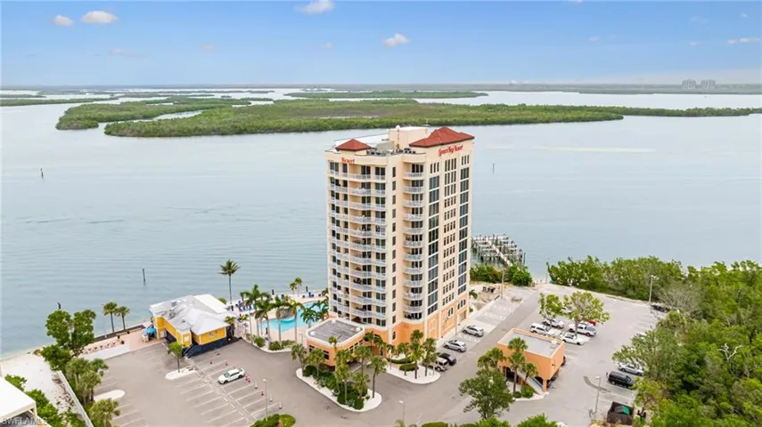 Aerial view of a nearby body of water and apartment complex