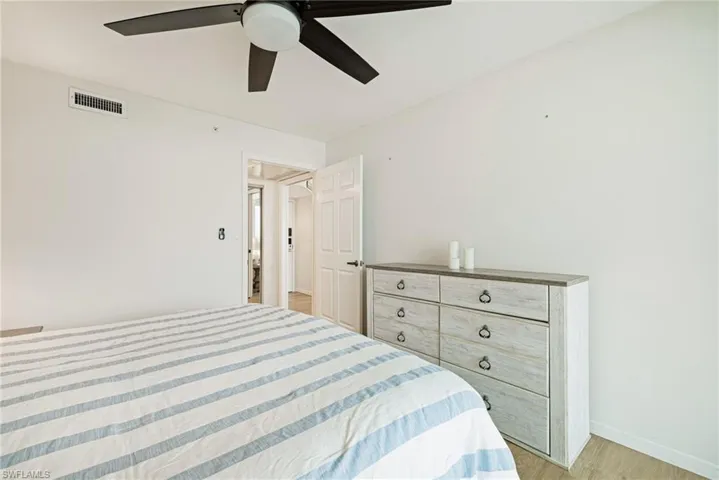 Bedroom with light wood-style flooring and ceiling fan