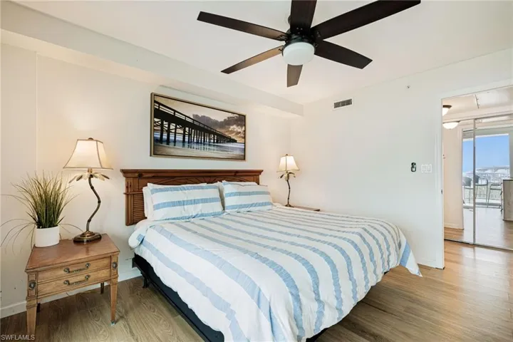 Bedroom with wood finished floors and ceiling fan