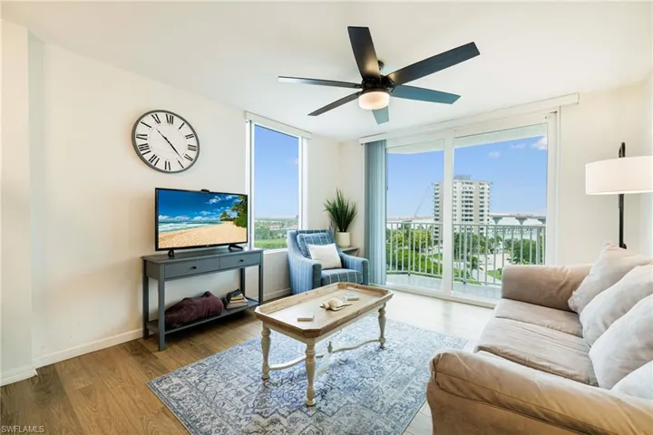 Living room with ceiling fan and wood finished floors