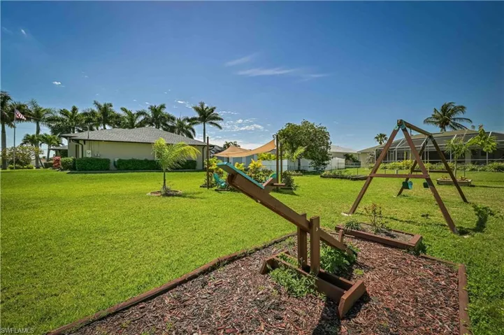 View of playground featuring a yard