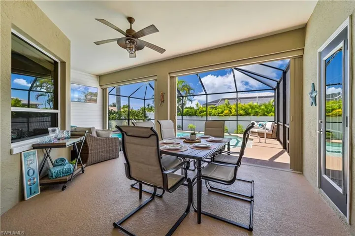 Sunroom / solarium with a ceiling fan