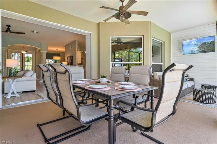 View of patio with visible vents, outdoor dining space, and a ceiling fan