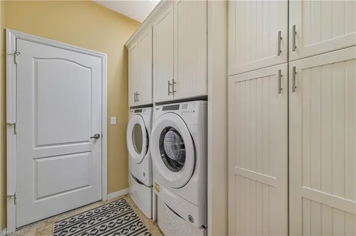 Laundry area with washing machine and dryer and cabinet space